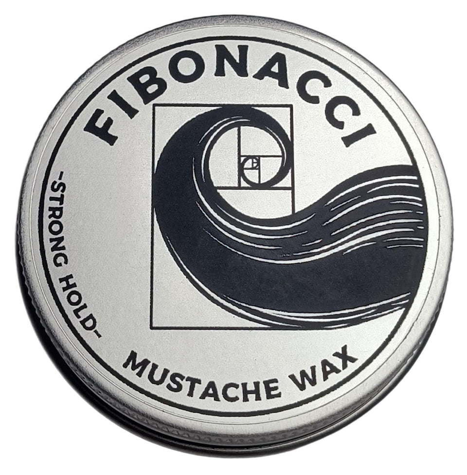 Fibonacci Mustache Wax front tin showing label and compact design for easy carry