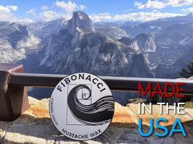 Fibonacci Mustache Wax next to a coin for scale to show true 1 oz travel size