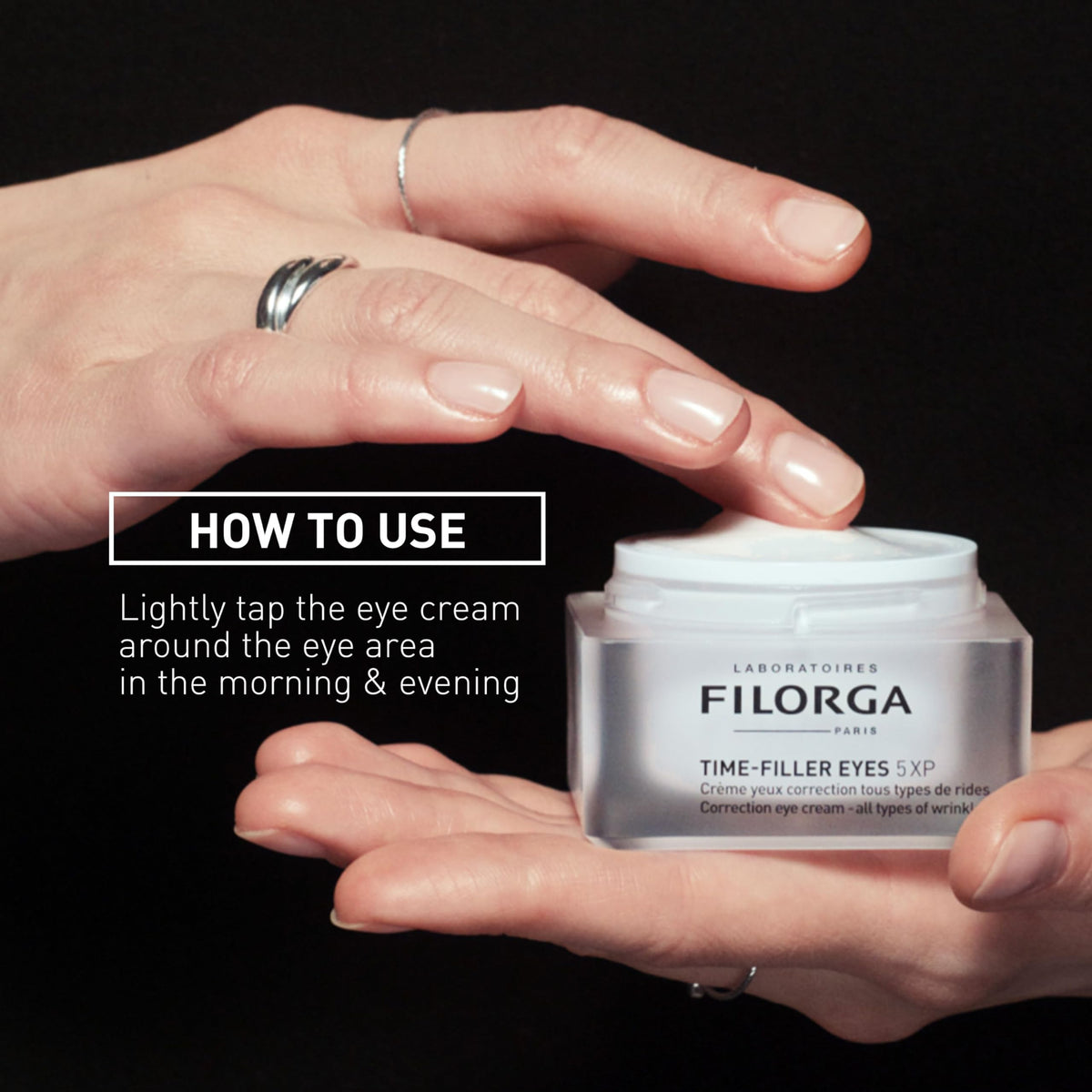 Filorga Time-Filler Eyes next to a hand for scale showing the compact travel-friendly size