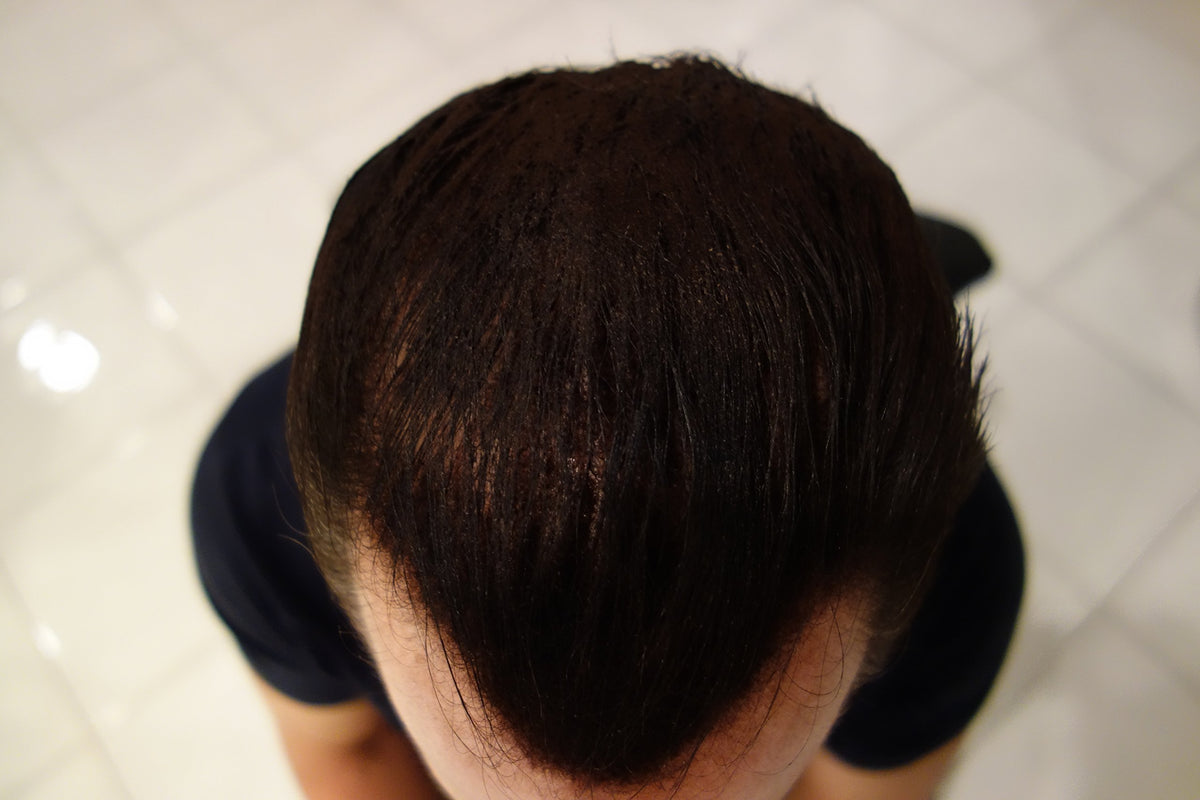 Finally Hair lifestyle image styling at mirror illustrating quick natural-looking results
