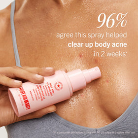 First Aid Beauty demonstration spraying back area for hard-to-reach benefit
