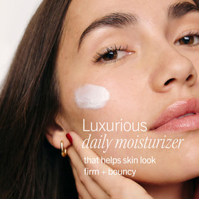 First Aid Beauty cream on hand demonstrating smooth application and quick absorption