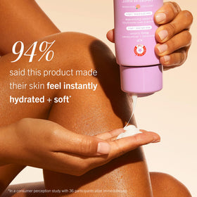 First Aid Beauty bottle beside hand for scale illustrating the 6.7 fl oz size