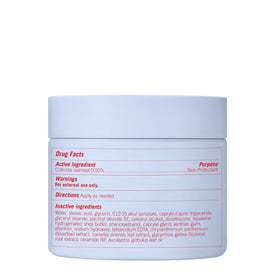 First Aid Beauty jar next to hand showing actual size for user convenience