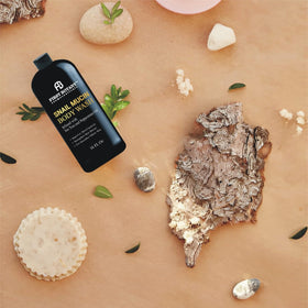 First Botany ingredients flatlay with tea tree and snail mucin benefits
