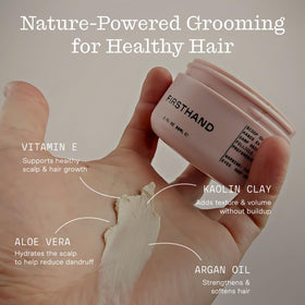 Firsthand styling on damp hair demonstrating defined, controlled shaping