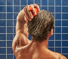 Close-up of Flakes shampoo lather showing cleansing action without overdrying