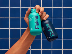 Flakes in-shower lifestyle scene demonstrating use during hair care