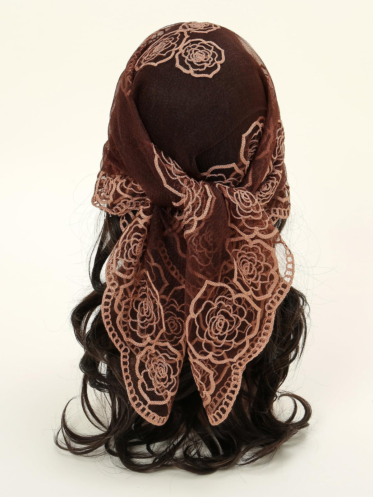 Floerns headscarf in use on model tying for comfortable secure styling