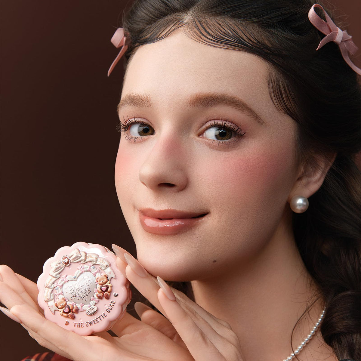 Flower Knows brush applying Rose Chanson to cheek for buildable natural color