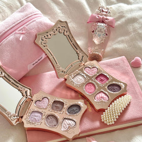 Flower Knows applying palette on model demonstrating wearable berry-pink styling