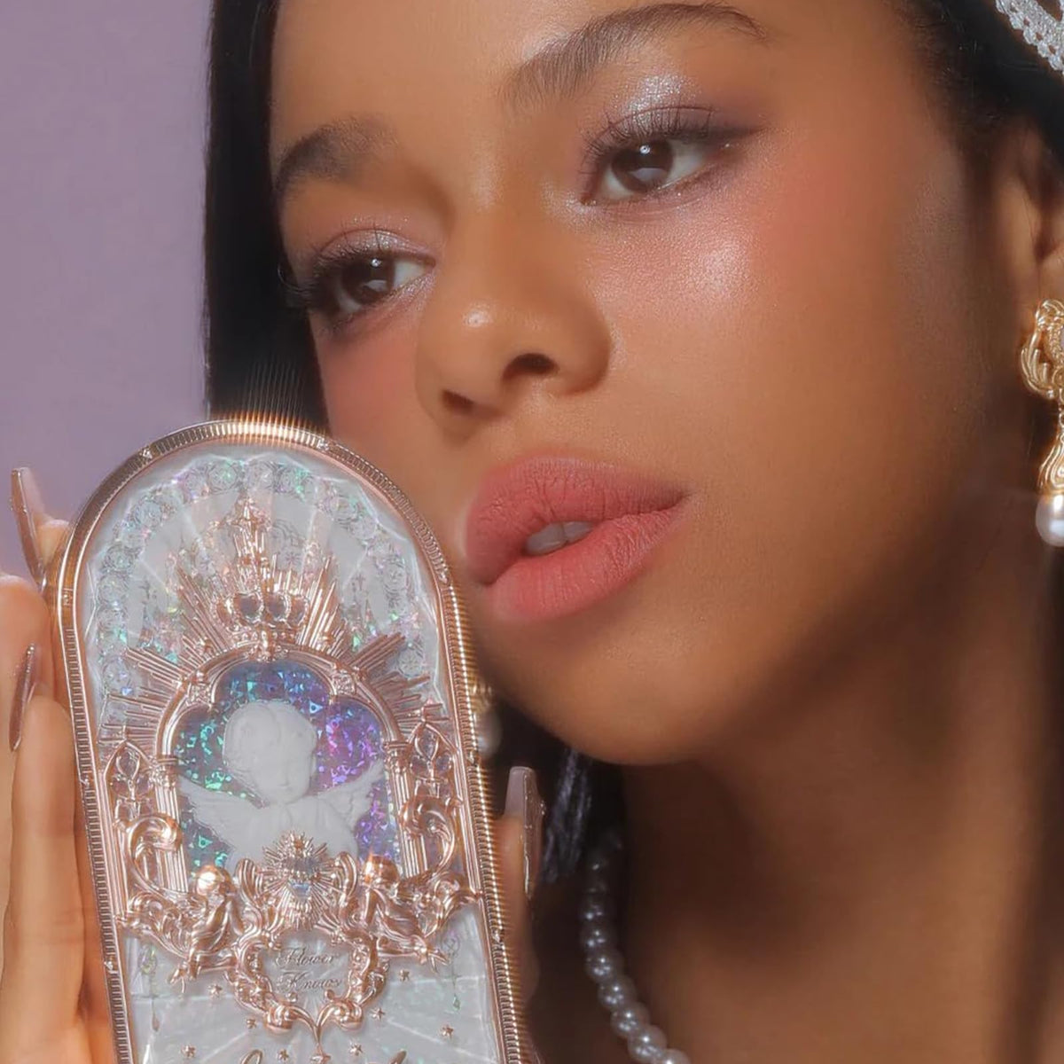 Flower Knows fingertip swatch on lid showing instant pigment payoff benefit