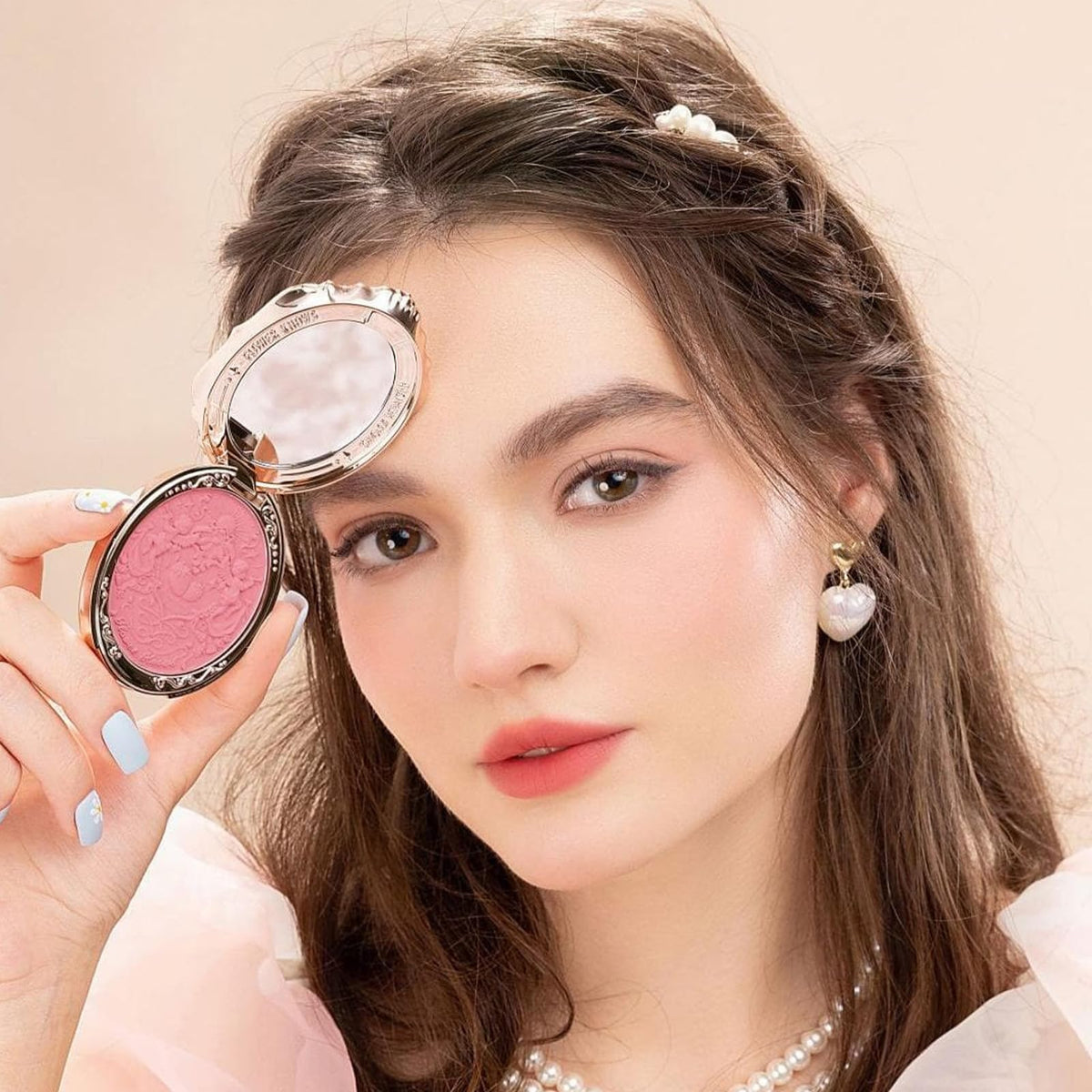 Flower Knows blush swatches on skin demonstrating buildable color