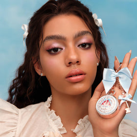 Flower Knows clipped to a purse showing bag placement benefit: always accessible hydration