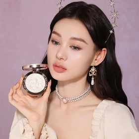 Flower Knows collarbone highlight lifestyle shot showing lit skin and wearable glow benefit: flattering radiance