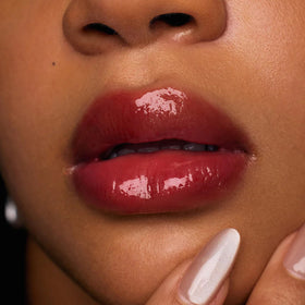 Flower Knows botanical ingredients display including squalane and meadowfoam seed oil nourishing lips