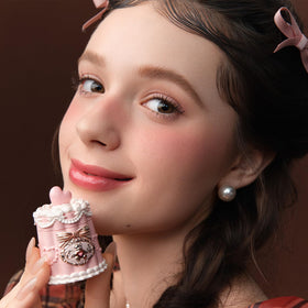 Flower Knows application on lips demonstrating plumping glassy shine effect