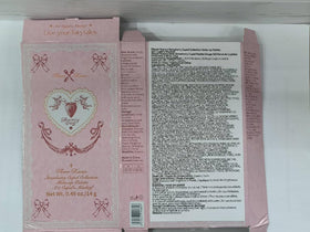 Flower Knows on a vanity with brushes showing romantic pink looks and styling