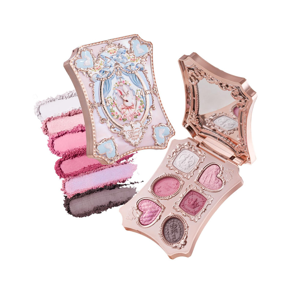 Flower Knows front compact showing gilded bunny garden design and collectible appeal