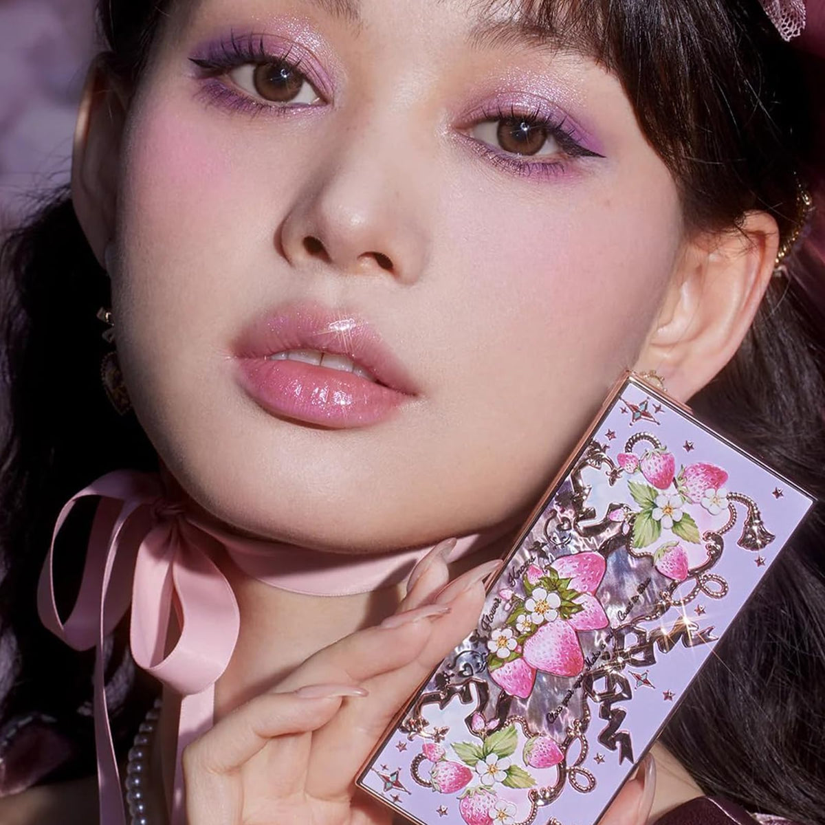 Flower Knows palette held by hand to show travel-friendly size and portability