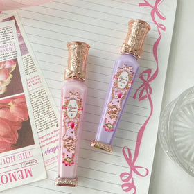 Flower Knows gloss next to ruler illustrating compact 0.12 fl oz travel-friendly size