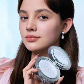 Flower Knows compact next to coin showing compact size and travel convenience benefit