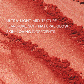 Flower Knows swatch on skin showing buildable citrus pink brightness