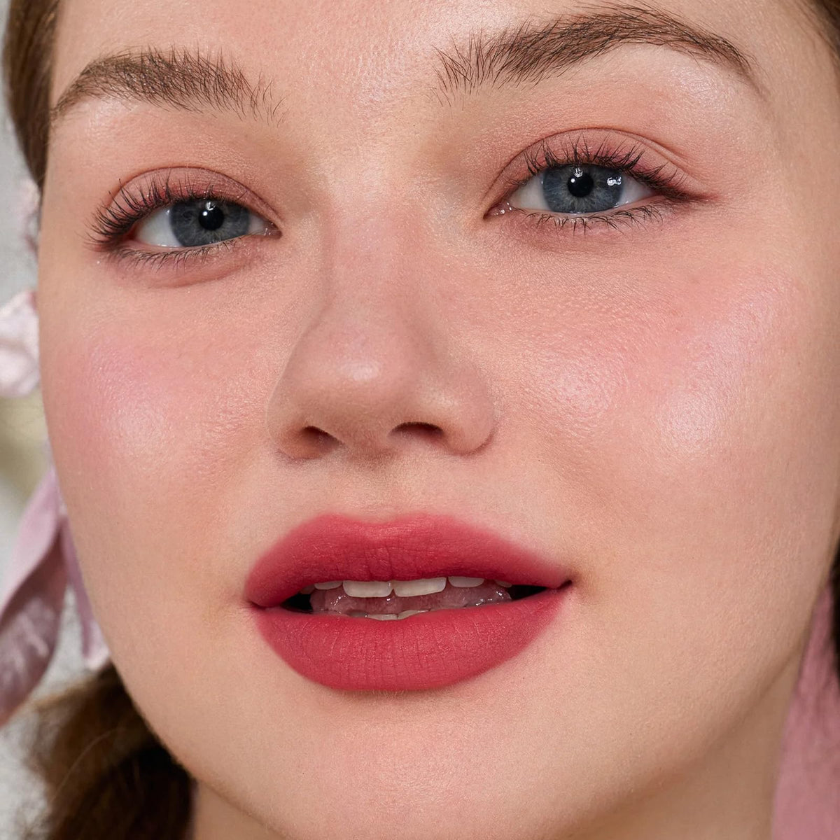 Flower Knows model wearing lipstick in daylight showing flattering bright pink