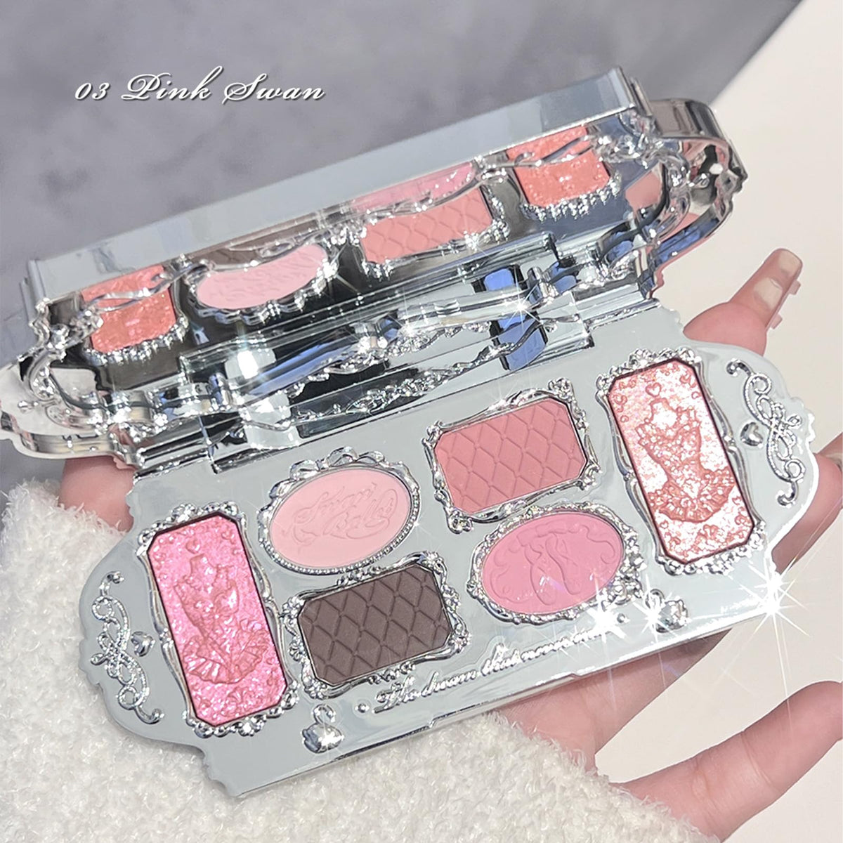 Flower Knows palette held in hand indicating compact travel-friendly size