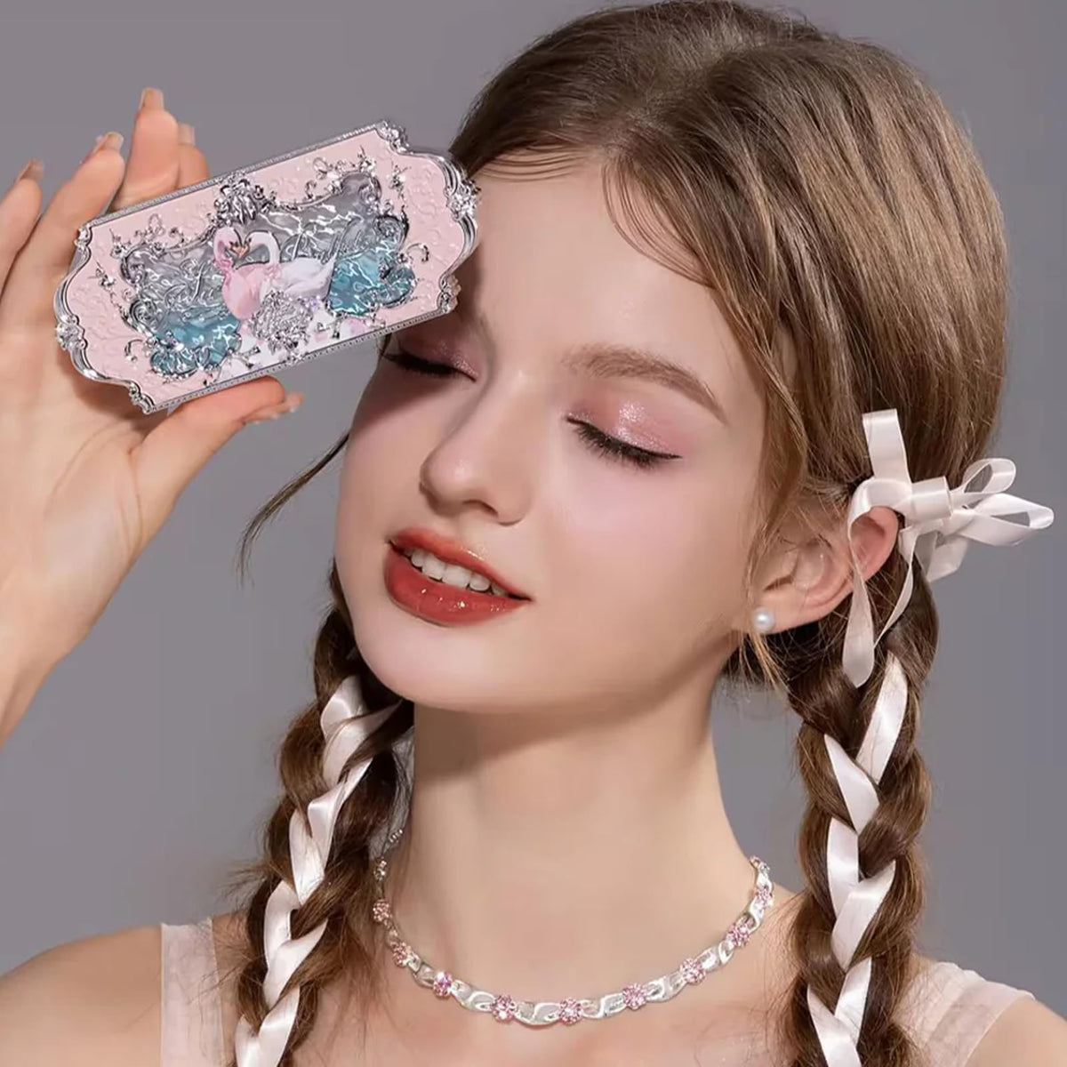 Flower Knows swatches on skin demonstrating buildable pink and shimmer payoff