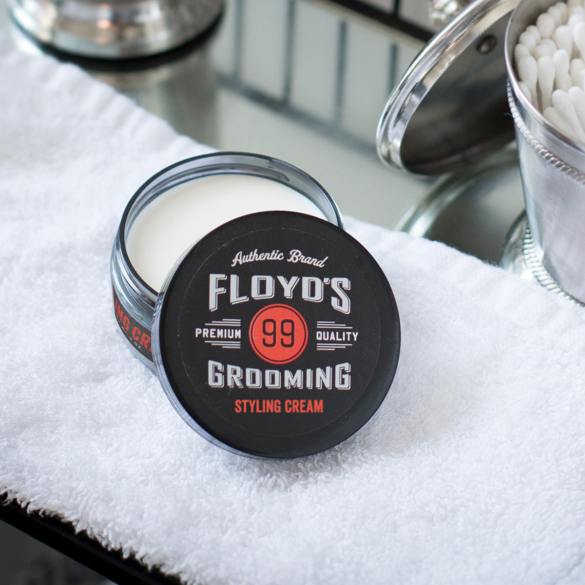 Floyd's 99 cream on hand being applied for even distribution and control