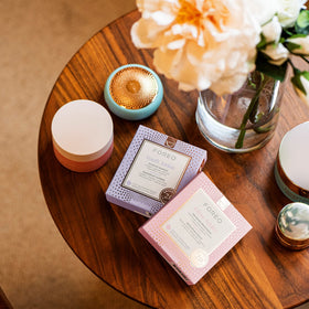 FOREO sachet next to common items to show pack size and convenient portability