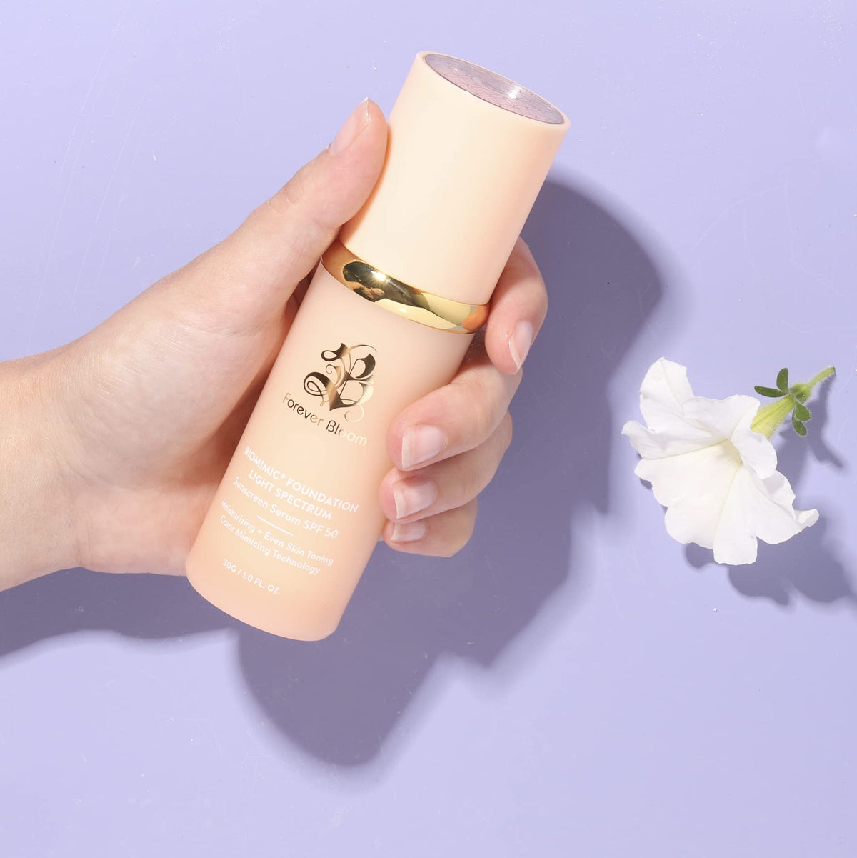 Forever Bloom applying foundation with fingers for quick blending benefit