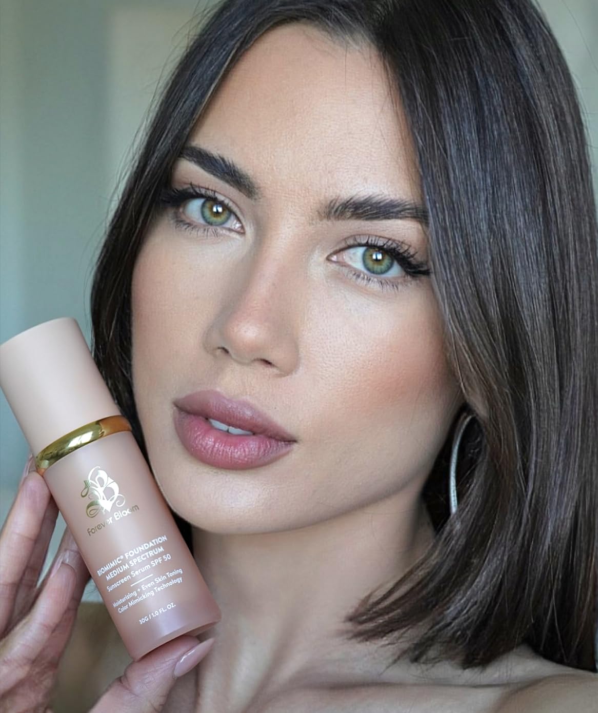 Forever Bloom size scale with hand conveying compact, travel-friendly benefit