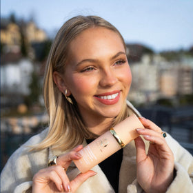 Forever Bloom swatch on light skin tone demonstrating adaptive color match benefit