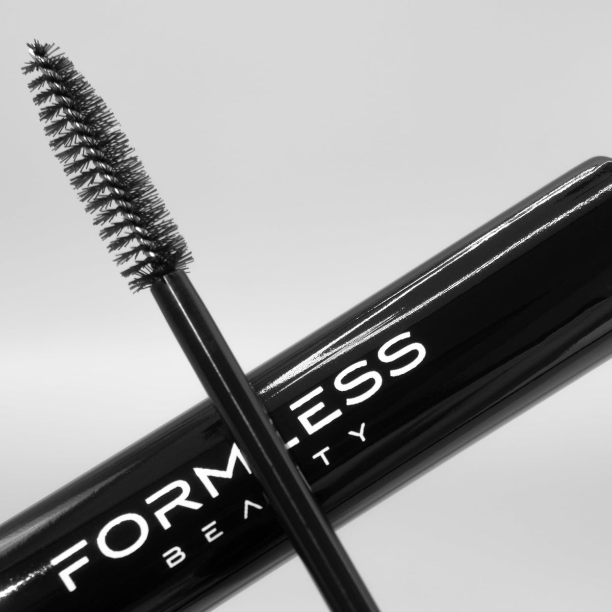 Formless Beauty mascara being applied to lashes in lifestyle setting for visible lengthening benefit