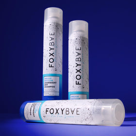 FoxyBae bottle next to travel pouch demonstrating portability and convenience benefit
