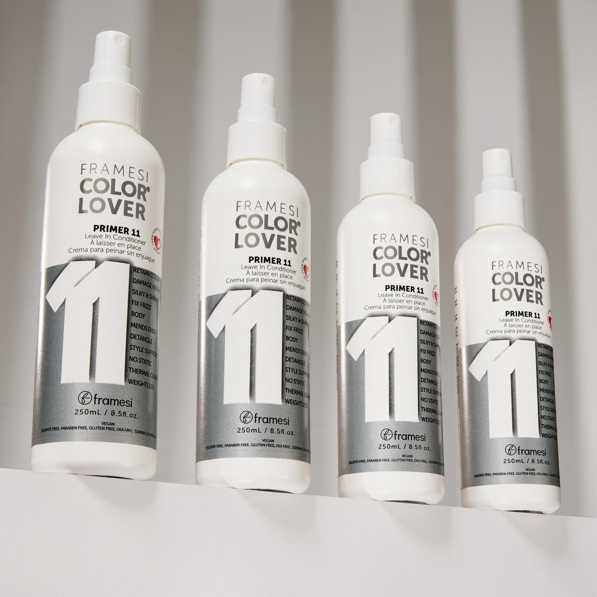 Framesi spray in hand dispensing mist to detangle and protect hair
