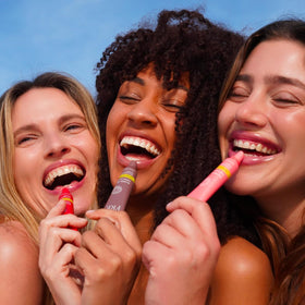 FRÉ lifestyle image outdoors showing lip tint with mineral SPF protection