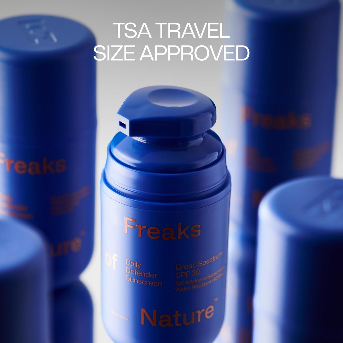 Freaks of Nature tube in hand showing compact 1.7 oz travel-friendly size