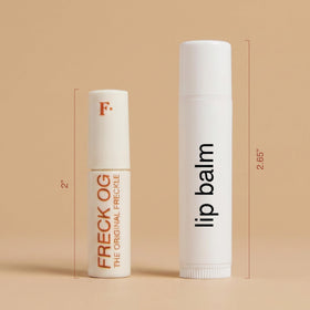 Freck Beauty pen held in hand to show the mini size and travel convenience
