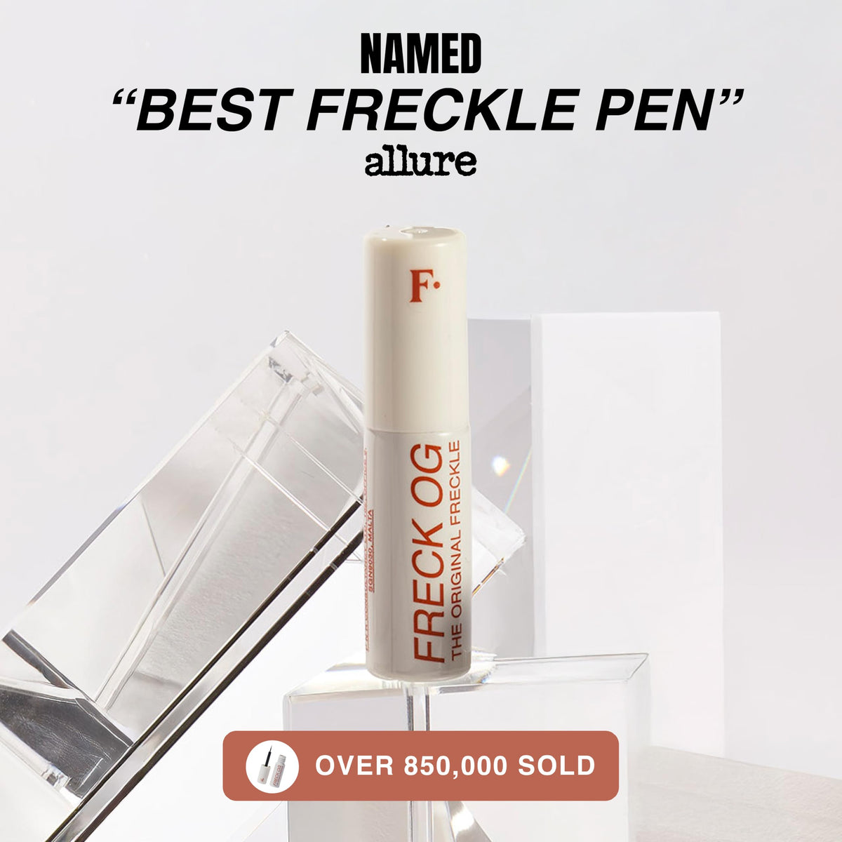 Freck Beauty pen beside makeup bag highlighting on-the-go touch-up ease