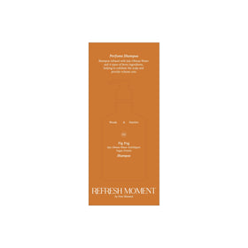 FREEMOMENT bottle close-up label highlighting vegan ingredients and mild surfactants