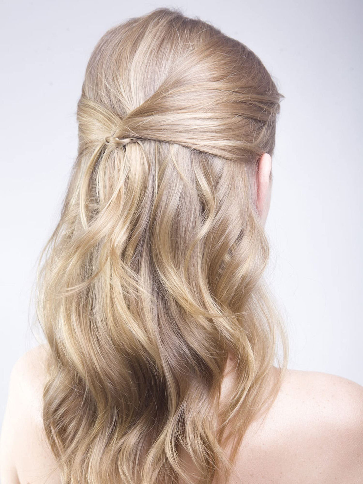 Frenchies pins used in a bridal updo for discreet photo-ready styling
