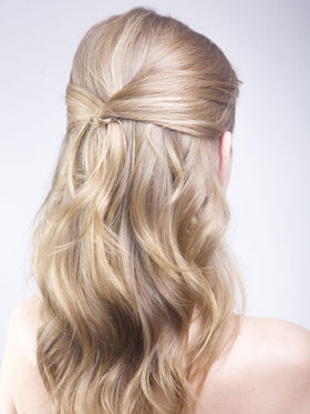 Frenchies pins used in a bridal updo for discreet photo-ready styling
