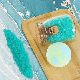 Frerdui bath bomb with bath salts staged to suggest relaxing soak benefits