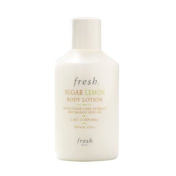 Fresh Sugar Lemon lotion pump dispensing cream on hand, demonstrating lightweight moisturizing effect