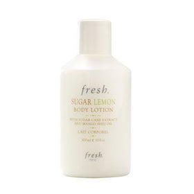 Fresh Sugar Lemon lotion pump dispensing cream on hand, demonstrating lightweight moisturizing effect