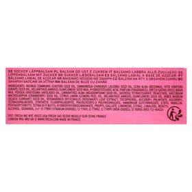 Fresh sugar lip treatment bloom swiped on lips showing sheer color boost