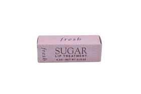 Fresh sugar lip treatment Petal lifestyle smiling model showing natural tinted finish